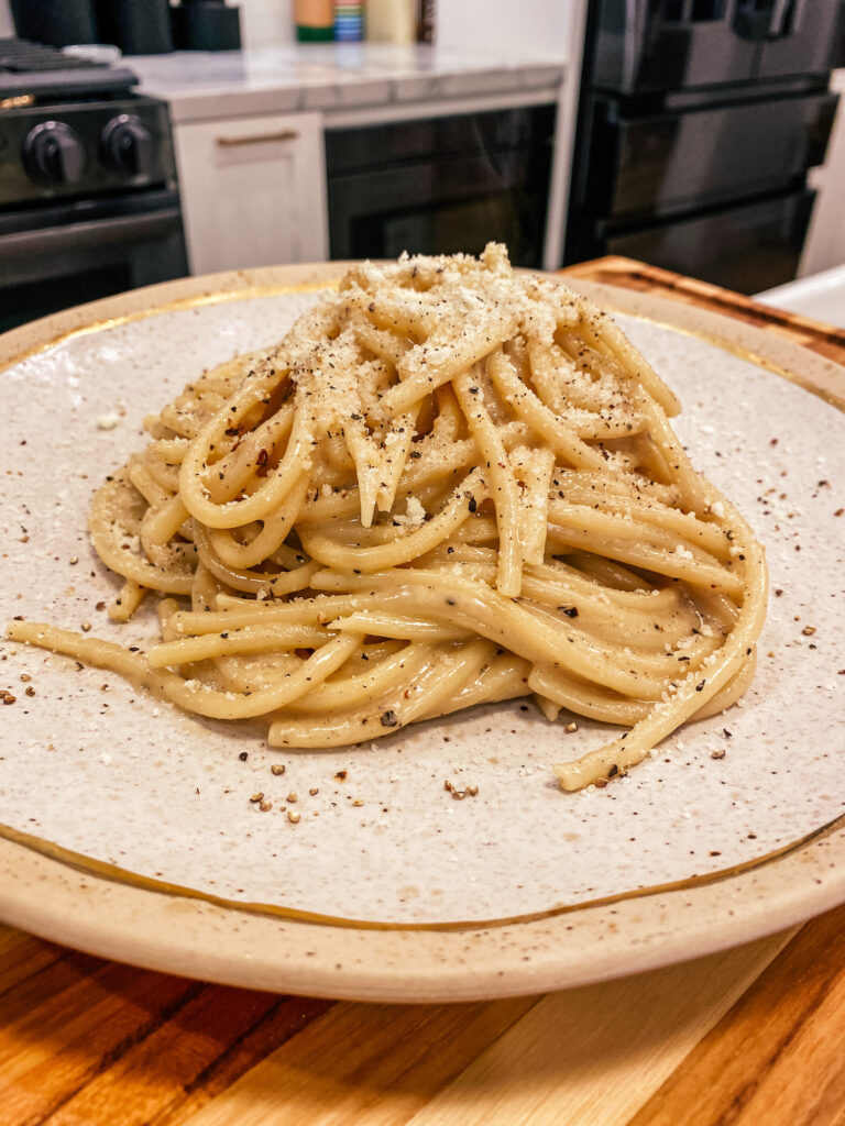 cacio e pepe pasta using spaghetti bucatini recipe with parmigiano reggiano and pecorino romano