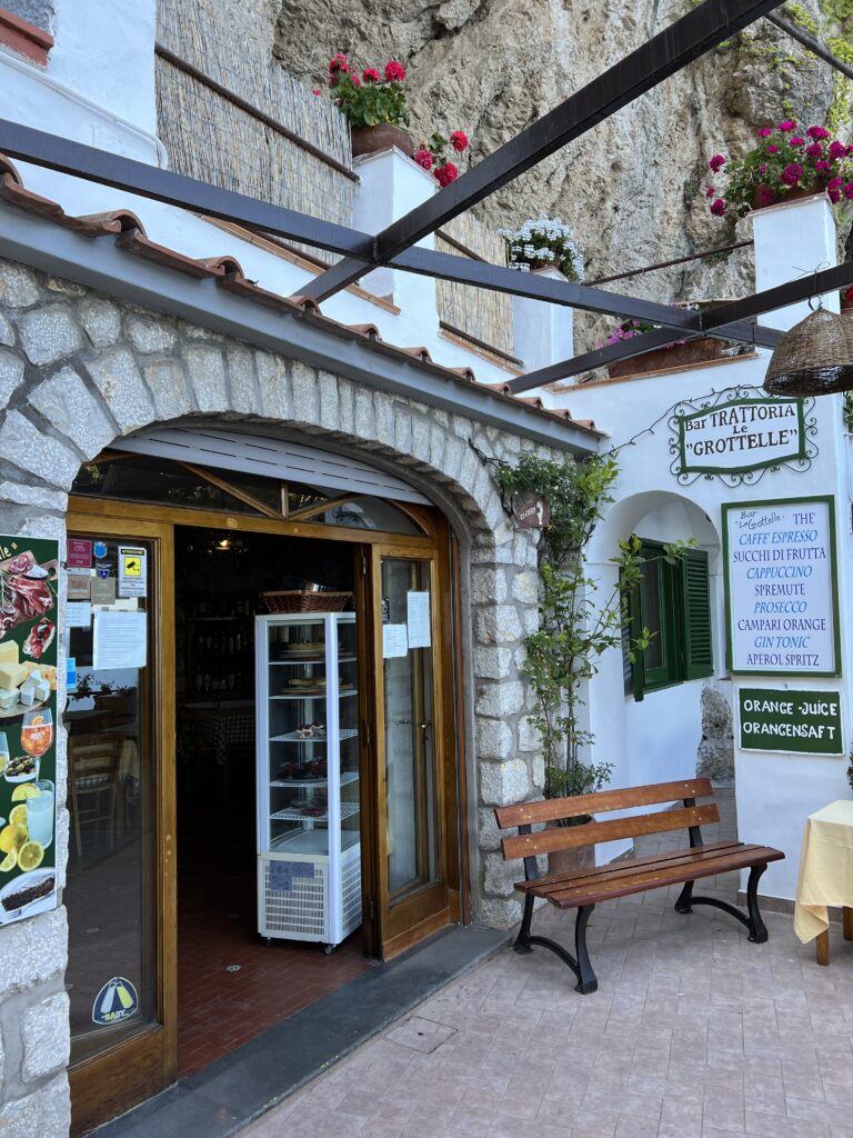 Capri italy travel guide for best restaurant at Le Grottelle in amalfi coast island