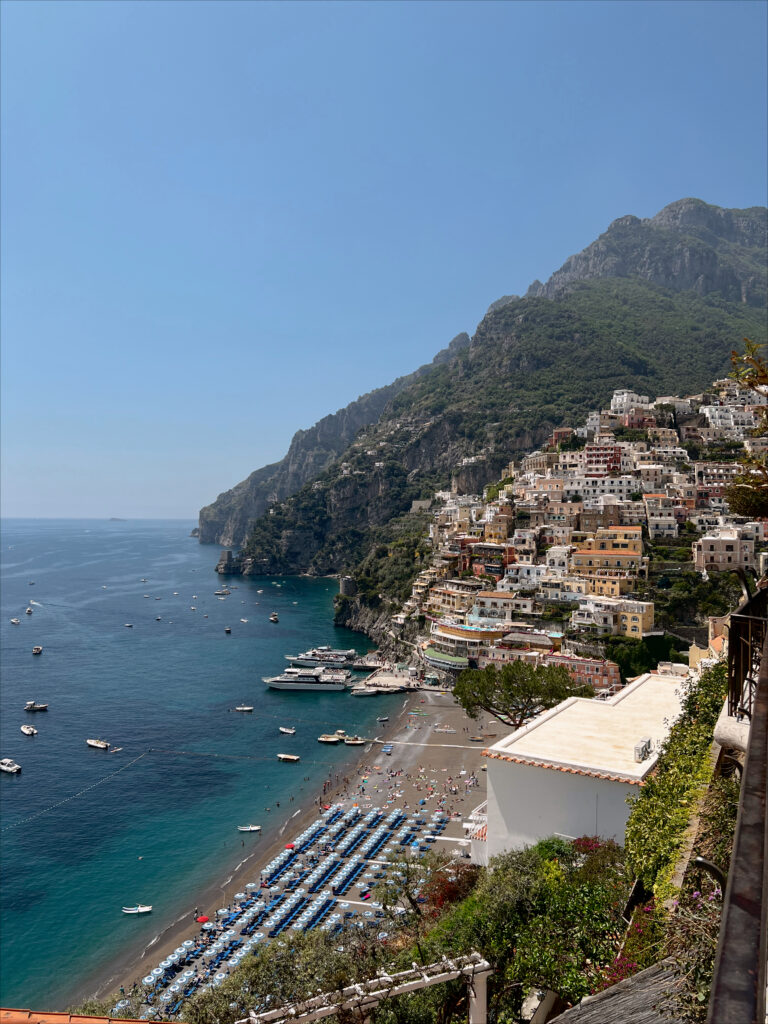 positano italy travel guide for beach view of spiaggia grande and arienzo beach club in amalfi coast