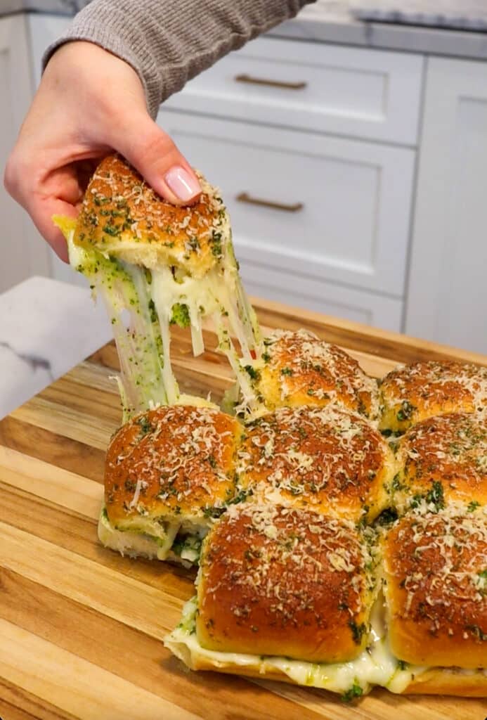 these Pesto Pizza Game Day Sliders are perfect for super bowl entertaining snacks or for a easy weeknight dinner